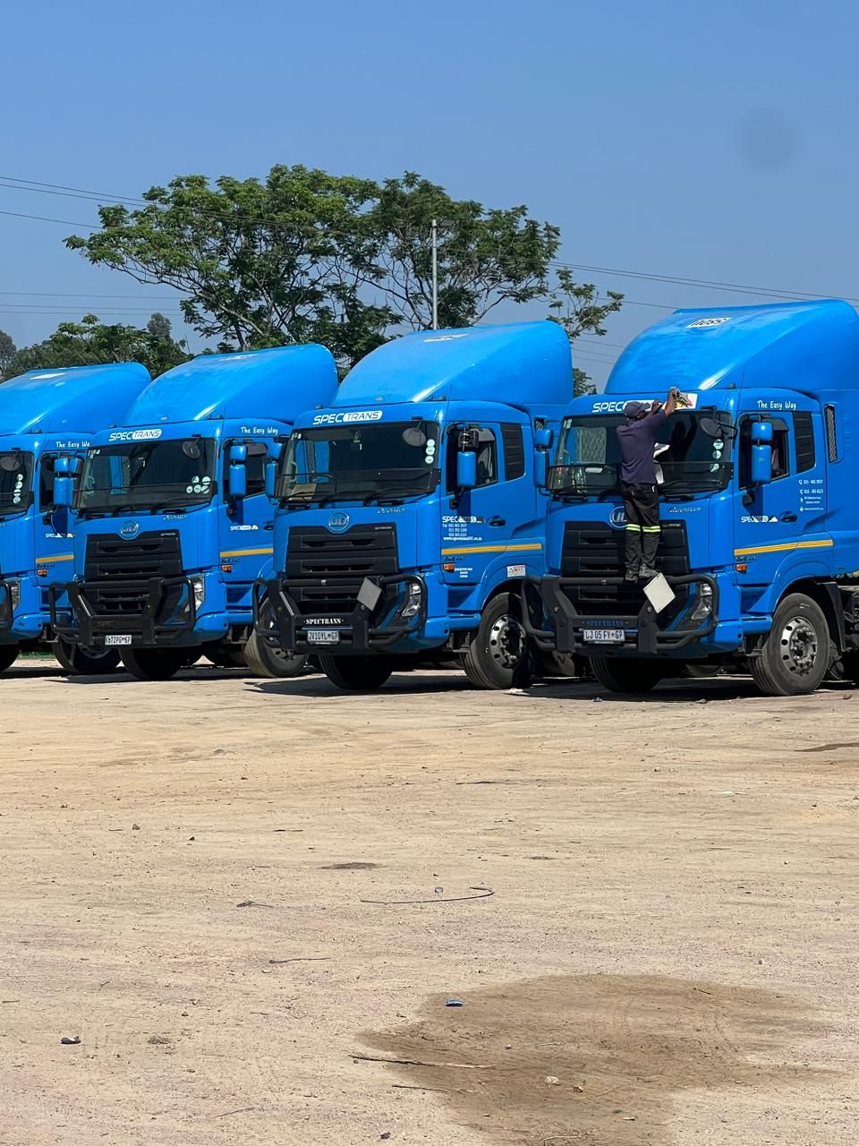 A line of Spectrans trucks ready for dispatch